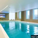 Home 22 재활치료 전문 병원 추천 - A modern rehabilitation center interior in Lisbon, featuring advanced virtual reality equipment and ...